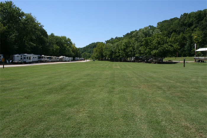We have a long riverfront row of campsites and a large grassy field for games and boat parking.